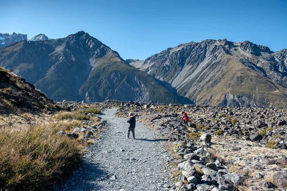 Kipton and Nathan from Backyard Travel Family check out the trail, on the Tasman Glacier Lake Walk, Short walk in Mt Cook National Park, perfect family walk with kids
