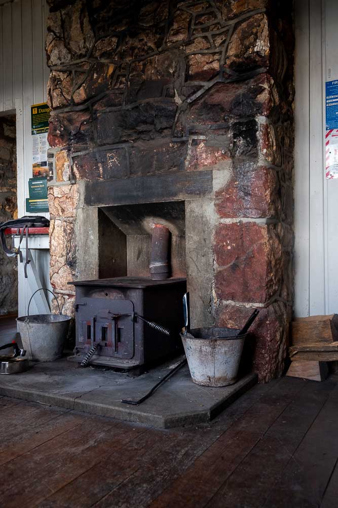 Old warm fire inside Packhorse Hut. You can stay here overnight in the bunk room, or stop here on a half day hike. It's nice and warm inside Packhorse Hut