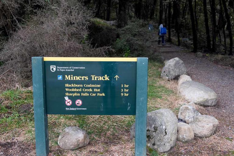Miners track signpost at the start of the Woolshed Creek Hut Track and Mt Somers Track, Mid Canterbury, New Zealand