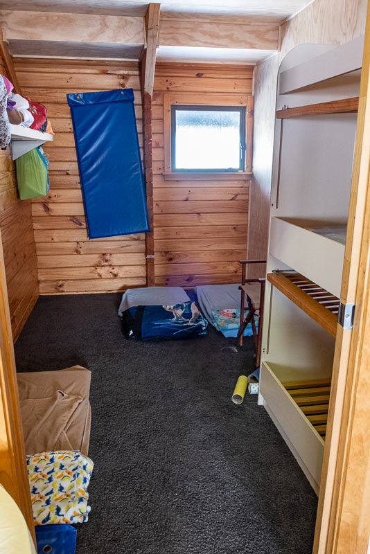 Sleep Room at Skiwiland Preschool, Mt Hutt, New Zealand. Two cot sleep spaces and camper style mattresses on the floor