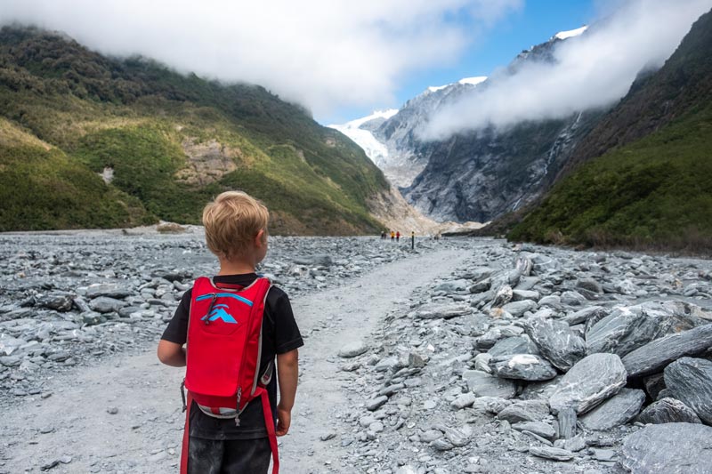 Young child walks the Franz Josef Glacier hike at 4 years old, an easy walk for kids in Franz Josef