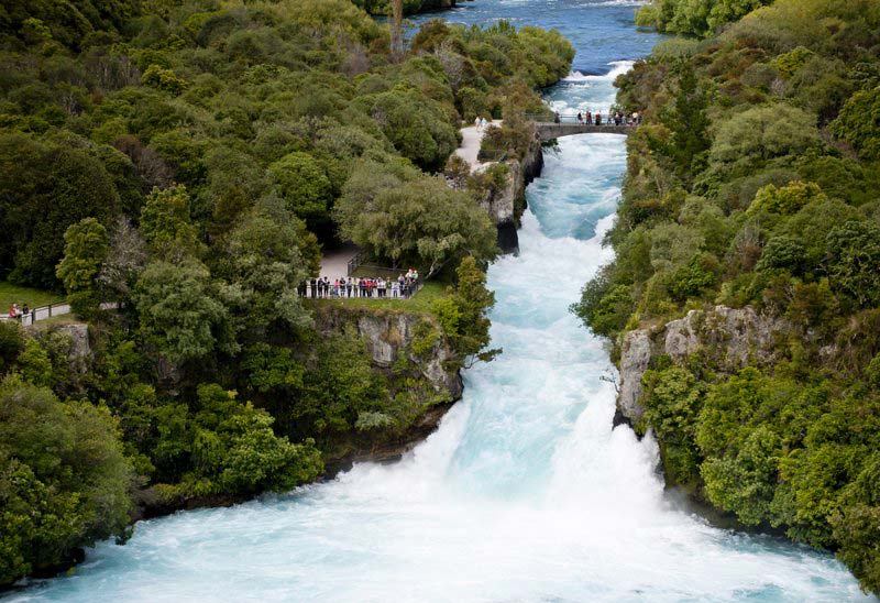 Aerial view of Huka Falls, a powering amount of water rushing down the river near Lake Taupo