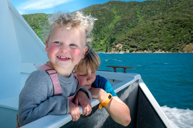 Kids smile while look at the view, on the Picton Mailboat