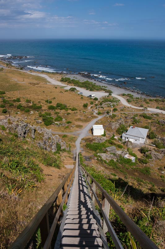 Looking down from the top of the stairs of the Cape Palliser Lighthouse with beautful blue ocean in the background
