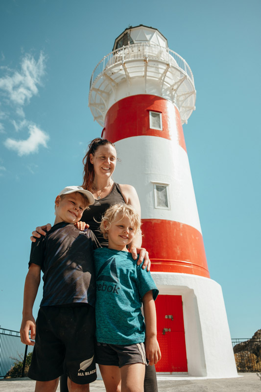 Family photo in front of the Cape Palliser Lighthouse near the Putangirua Pinnacles