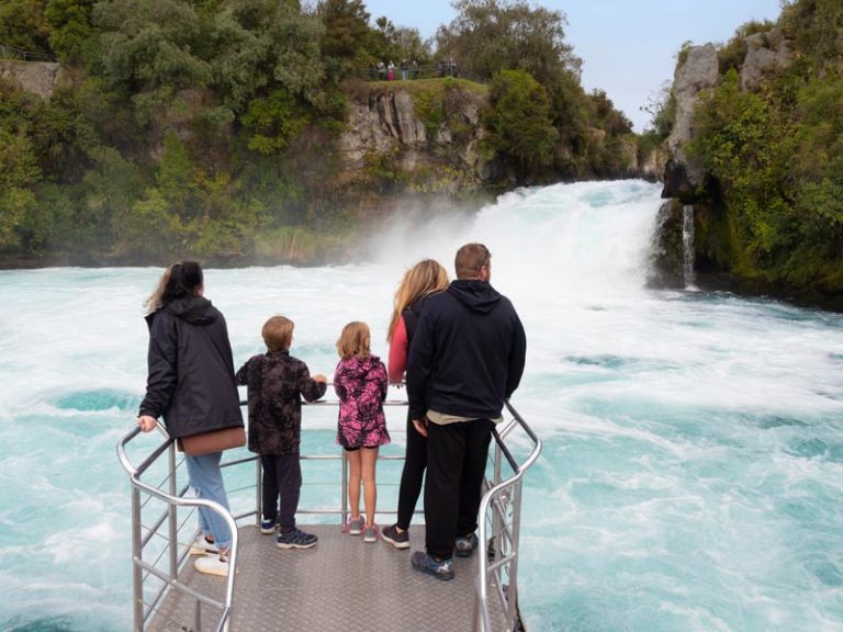 A family take a boat cruise on Lake Taupo and visit Huka Falls