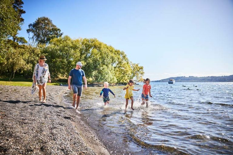 A family of 5 walk and swim in Lake Taupo NZ